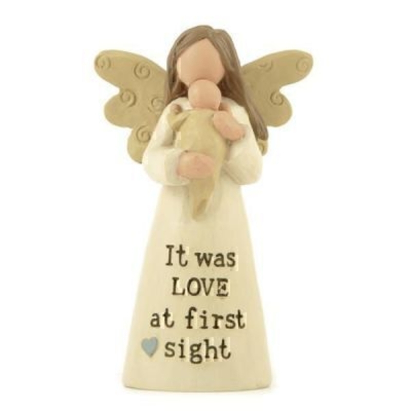 This Angel with a Baby Ornament with the quote It Was Love at First Sight by Heaven Sends would be the perfect gift for any Mother. Featuring a cream angel holding a swaddled baby in her arms and the quote written below on the dress of the angel. A lovely